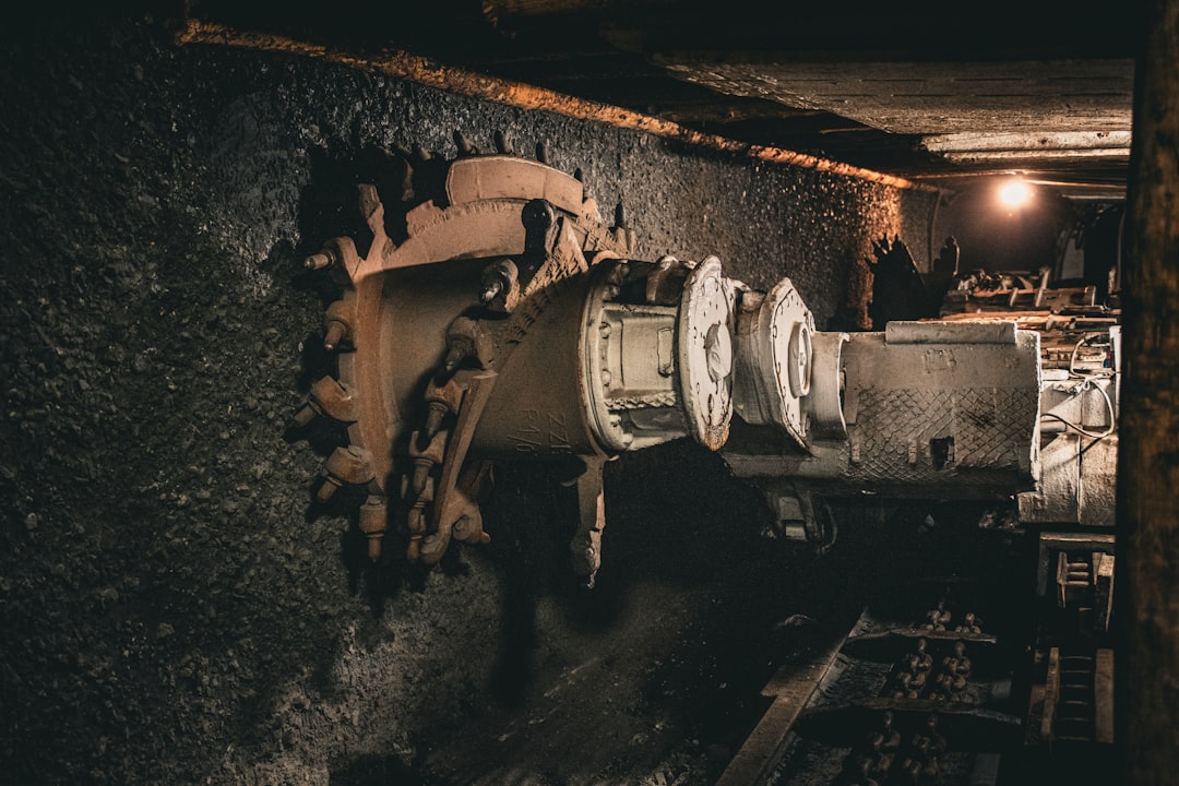A very old looking machine in a very dark room