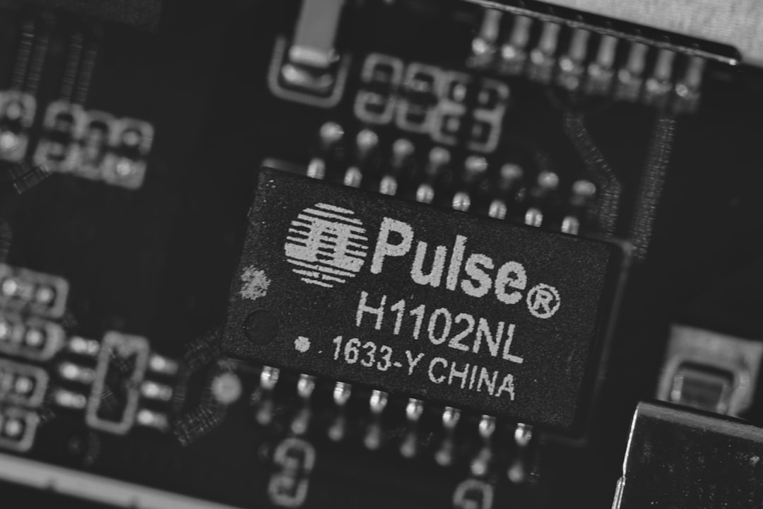 Close-up of a pulse h1102nl electronic component.