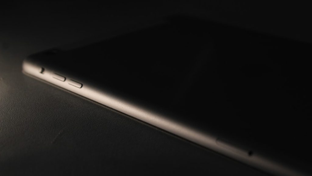 a close up of a cell phone on a table