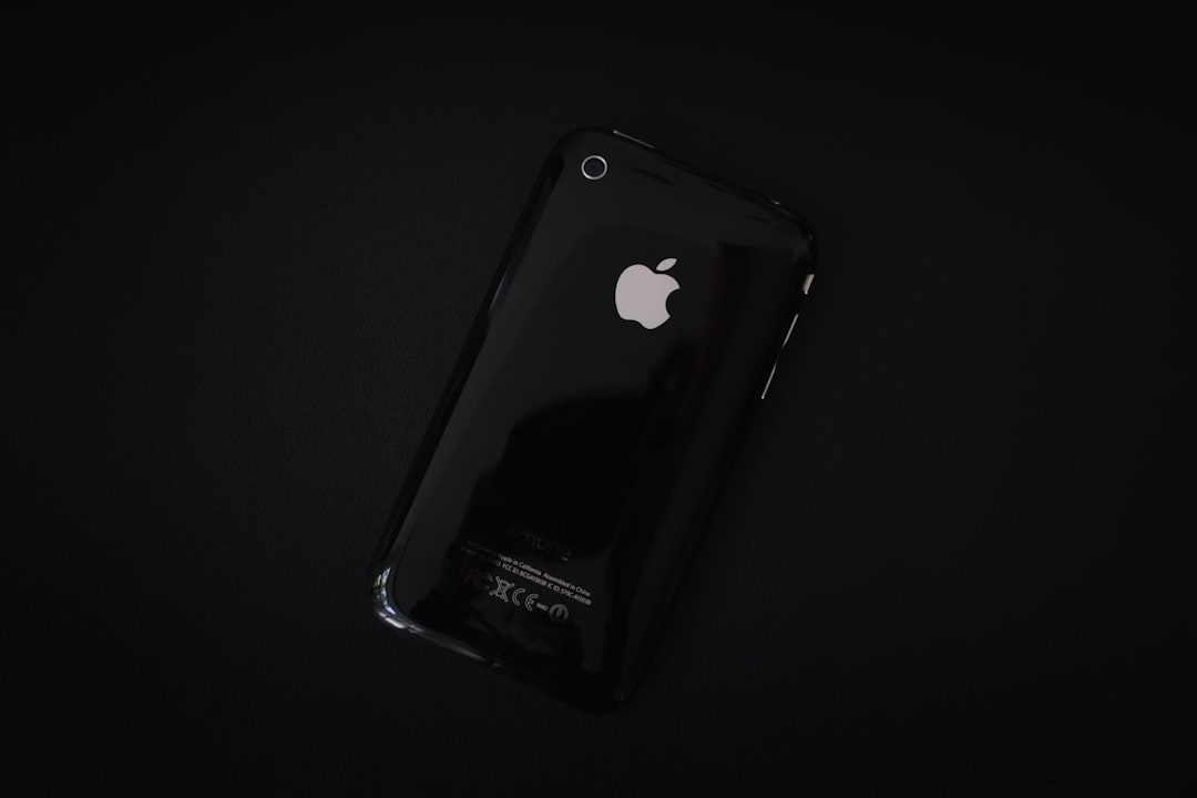 black iphone 4 on white surface