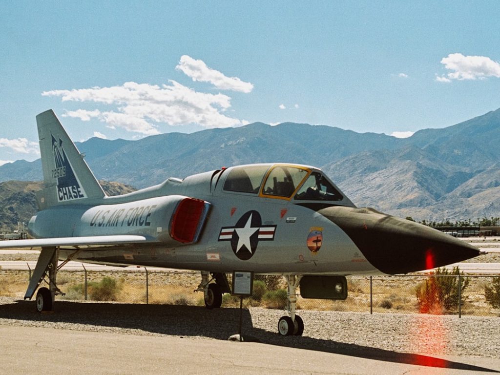 A parked united states air force jet fighter aircraft outdoors