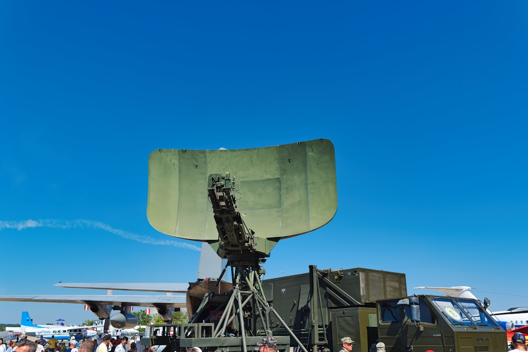 Military radar dish on a vehicle outdoors